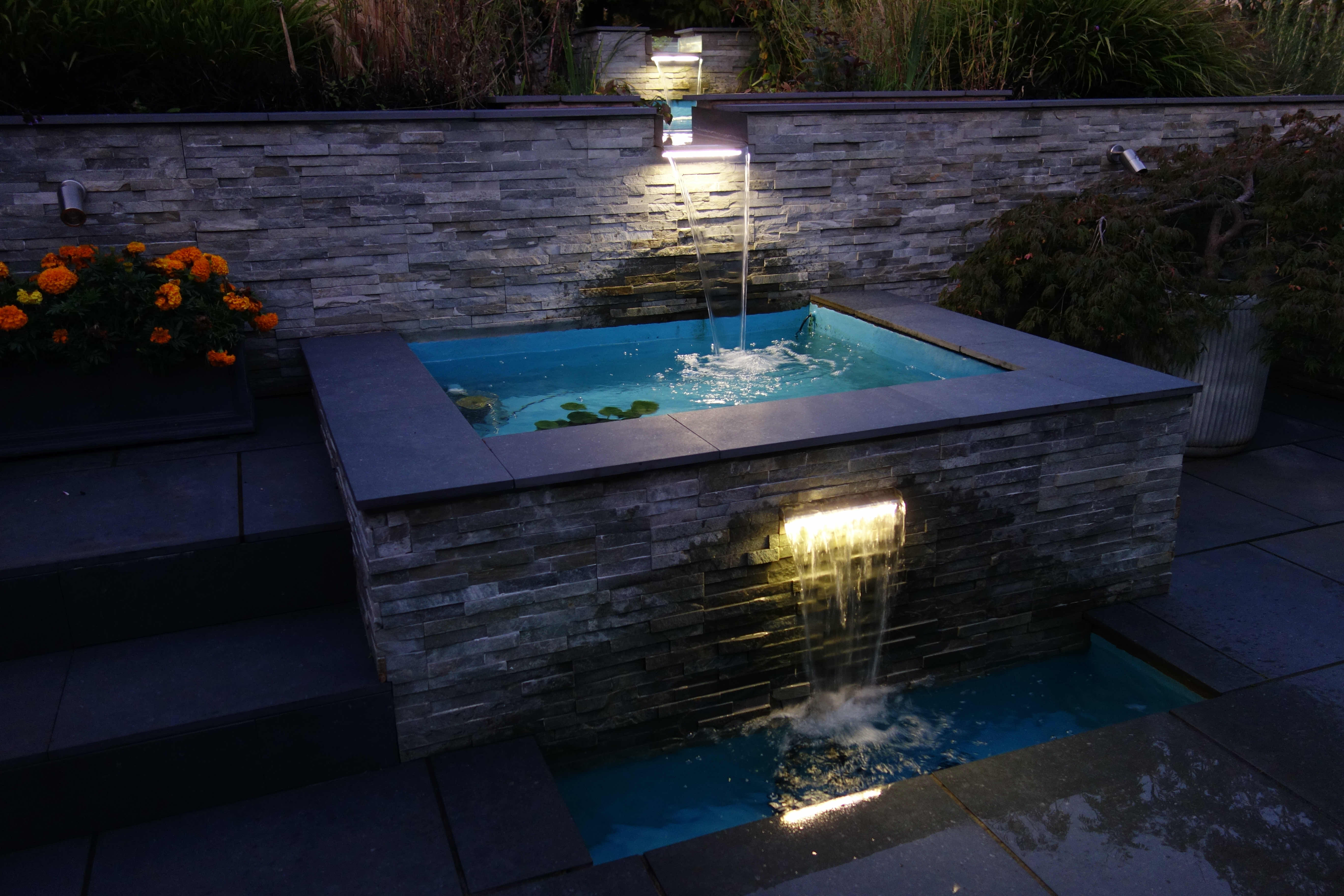 Four ponds connected by illuminated waterfalls in Frodsham.